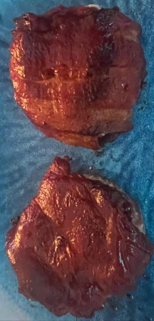 BBQ sauce brushed Bacon wrapped onion cheeseburger